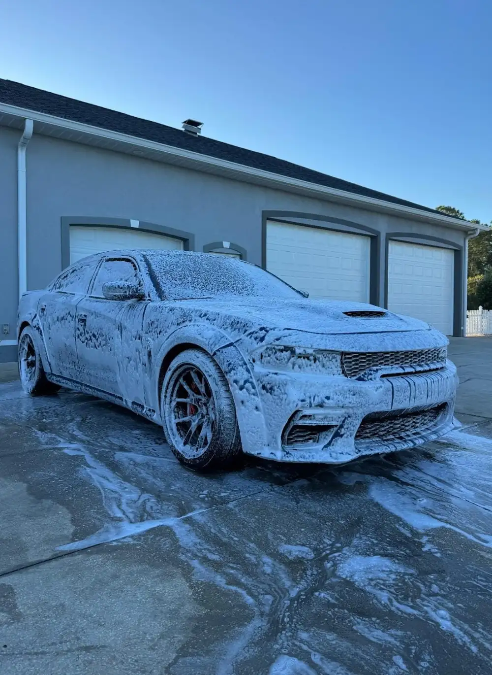 Dodge Charger covered in thick pre-wash foam