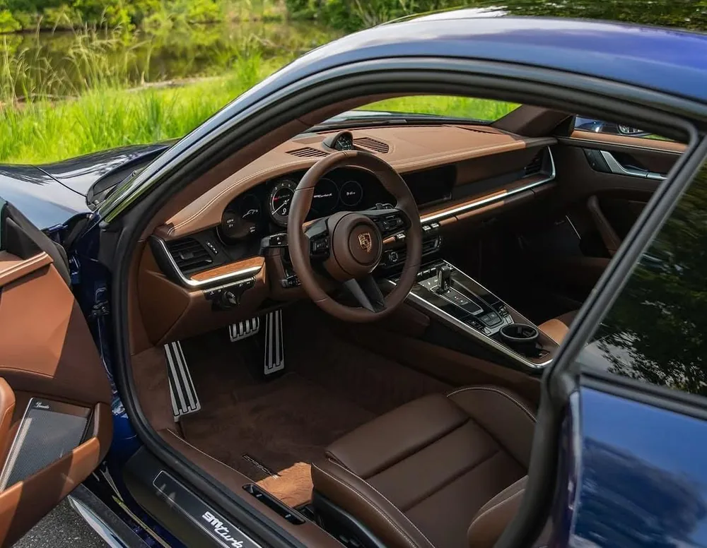 Spotless brown leather seats seen through an open door